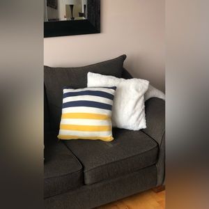 Knitted striped decorative throw pillow. Yellow, navy & cream.